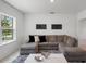 Cozy living room with comfortable seating and stylish decor at 1551 Gateway Ln, Kissimmee, FL 34746