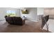 Spacious loft featuring plush carpet, a modern staircase and comfortable reclining furniture at 1551 Gateway Ln, Kissimmee, FL 34746