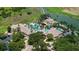 Aerial view of the community pool and gathering area surrounded by lush landscaping at 1551 Gateway Ln, Kissimmee, FL 34746