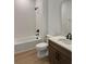 Well-lit bathroom with a combined tub and shower, modern fixtures, and tile accents at 1646 Pinecliff Dr, Apopka, FL 32703