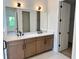 Bright bathroom with double sink vanity, quartz countertop, and modern fixtures at 1646 Pinecliff Dr, Apopka, FL 32703