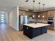 Stylish kitchen with a large island, stainless steel appliances, and a decorative backsplash at 1646 Pinecliff Dr, Apopka, FL 32703