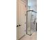Modern bathroom showcasing glass shower with black trim and white herringbone tile at 1646 Pinecliff Dr, Apopka, FL 32703