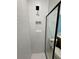 Modern shower with white subway tile and a black showerhead at 1646 Pinecliff Dr, Apopka, FL 32703
