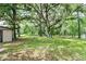 Lush backyard featuring mature trees and ample green space, offering a serene and private outdoor setting at 1753 Nw 44Th St, Ocala, FL 34475