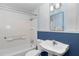Classic bathroom design featuring white tile, updated fixtures and a crisp white sink at 1753 Nw 44Th St, Ocala, FL 34475