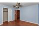 Spacious bedroom with hardwood floors, closet, and painted blue walls at 1753 Nw 44Th St, Ocala, FL 34475