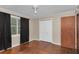 Bedroom with wood floors, closet with double doors, and natural light from the window at 1753 Nw 44Th St, Ocala, FL 34475
