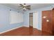 Comfortable bedroom featuring wood floors, painted walls, ceiling fan and closet at 1753 Nw 44Th St, Ocala, FL 34475
