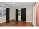 Bedroom features wood floors, neutral walls, a window, and a closet with double doors at 1753 Nw 44Th St, Ocala, FL 34475