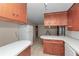 Spacious kitchen with ample counter space, wooden cabinets and tile floors at 1753 Nw 44Th St, Ocala, FL 34475