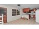 Bright kitchen with tiled floors, plenty of cabinets, and a cozy breakfast bar area at 1753 Nw 44Th St, Ocala, FL 34475