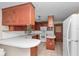 Functional kitchen equipped with a microwave, white appliances and extended countertop space at 1753 Nw 44Th St, Ocala, FL 34475
