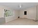 Bright living room with tile floors, a ceiling fan, and natural light from the window at 1753 Nw 44Th St, Ocala, FL 34475