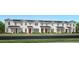 Charming row of new townhomes with HardiePlank siding and covered porches at 1862 Falconhurst Ln, Apopka, FL 32703