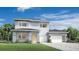 Modern two-story home with a three car garage, lovely landscaping and contemporary design at 1880 Stonecliff Dr, Apopka, FL 32703