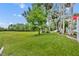 Expansive green backyard, offering a peaceful and open space at 195 River Village Drive, Debary, FL 32713