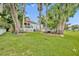 Wide view of backyard with seating and mature trees, perfect for outdoor enjoyment at 195 River Village Drive, Debary, FL 32713
