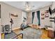 Cozy bedroom with gray walls, natural lighting, ceiling fan, and workout equipment at 195 River Village Drive, Debary, FL 32713