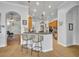 Open kitchen with breakfast bar, pendant lighting, and adjacent living areas at 195 River Village Drive, Debary, FL 32713