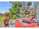 Deck area with red lounge chairs and outdoor views at 195 River Village Drive, Debary, FL 32713