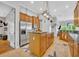Modern kitchen featuring stainless steel appliances and a kitchen island at 195 River Village Drive, Debary, FL 32713