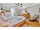 The main bedroom features wood floors, neutral paint, and an ensuite bathroom and walk-in closet at 195 River Village Drive, Debary, FL 32713