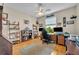 Home office with wood-look floors, large window and built-in shelving at 195 River Village Drive, Debary, FL 32713