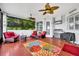 Outdoor veranda including red seating and a grill at 195 River Village Drive, Debary, FL 32713