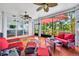 Covered veranda with tile flooring and outdoor seating at 195 River Village Drive, Debary, FL 32713