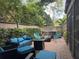 Relaxing backyard featuring comfortable seating, an outdoor table, and a tranquil hot tub at 200 Hummingbird Ln, Longwood, FL 32779
