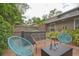 Relaxing backyard with a hot tub, patio furniture, and a well-maintained privacy fence at 200 Hummingbird Ln, Longwood, FL 32779