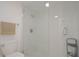 Modern bathroom with a glass-enclosed shower, featuring a tile floor, toilet, and neutral tones at 200 Hummingbird Ln, Longwood, FL 32779