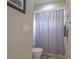 Cozy bathroom featuring a toilet, shower with curtain, and neutral wall colors at 200 Hummingbird Ln, Longwood, FL 32779