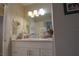 Bright bathroom with a modern vanity, stylish mirror, and updated lighting fixtures at 200 Hummingbird Ln, Longwood, FL 32779