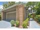 Brick home with an attached two-car garage, mature landscaping, and charming brick accents at 200 Hummingbird Ln, Longwood, FL 32779