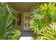 Front door entrance framed by lush greenery and providing a welcoming ambiance at 200 Hummingbird Ln, Longwood, FL 32779