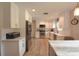 Well-appointed kitchen featuring white cabinets, stainless steel appliances, and plenty of counter space for cooking at 200 Hummingbird Ln, Longwood, FL 32779