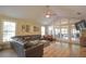 Spacious living room featuring a vaulted ceiling, wood flooring, and lots of natural light at 200 Hummingbird Ln, Longwood, FL 32779
