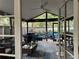 Inviting screened patio featuring comfortable seating areas and a ceiling fan at 200 Hummingbird Ln, Longwood, FL 32779
