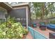 Screened in outdoor patio area with stylish seating, perfect for entertaining guests at 200 Hummingbird Ln, Longwood, FL 32779