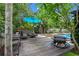 Backyard oasis with a refreshing pool and spa combination, highlighted by an umbrella and a fire pit at 2190 Temple Dr, Winter Park, FL 32789
