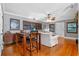 Open-concept living area featuring hardwood floors, stylish furnishings, and a dining space at 2190 Temple Dr, Winter Park, FL 32789