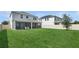 Large backyard with green grass, screened patio, and privacy fence at 2279 Mountain Pine St, Ocoee, FL 34761
