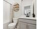 Well-lit bathroom featuring a shower and tub with a modern shelf and vanity at 2279 Mountain Pine St, Ocoee, FL 34761