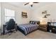 Bedroom with striped bedding, desk, wall shelves, carpet, and natural light at 2279 Mountain Pine St, Ocoee, FL 34761