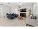 Modern living room with tile floors, comfortable seating, stylish furnishings and bright neutral colors at 2279 Mountain Pine St, Ocoee, FL 34761