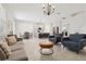Spacious open-concept living area connects living room, kitchen and dining space in neutral colors at 2279 Mountain Pine St, Ocoee, FL 34761