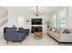 Modern living room featuring tile floors, comfortable seating, stylish furnishings and bright neutral colors at 2279 Mountain Pine St, Ocoee, FL 34761