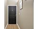Inviting entryway featuring a modern door and neutral wall colors, creating a warm welcome at 2308 Donegan Pl, Orlando, FL 32826